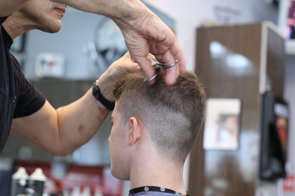 Picture of young man getting haircut